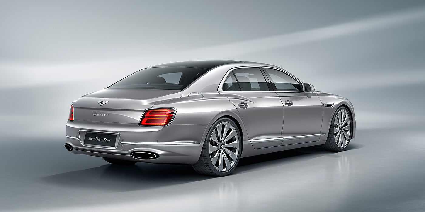 Bentley Leeds New Bentley Flying Spur sedan rear view in Silverlake paint with ten spoke wheels and chrome matrix grille
