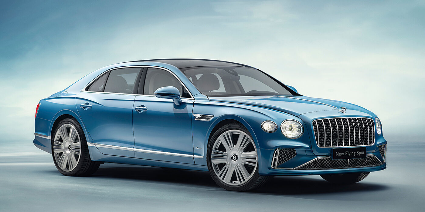 Bentley Leeds New Bentley Flying Spur Azure sedan front view in Light windsor blue by Mulliner paint with 22 inch Azure wheels and chrome exterior details