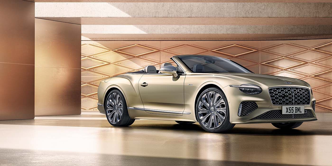 Bentley Leeds Bentley New Continental GTC Mulliner V8 hybrid front three quarters in Patina paint