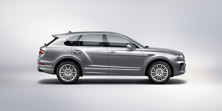 Bentley Leeds Bentley Bentayga SUV side profile in Moonbeam silver paint against white background featuring 21 inch 5 spoke wheels