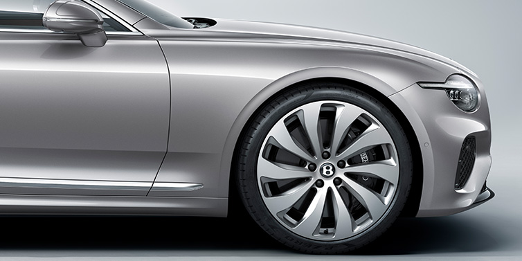 Bentley Leeds New Bentley Continental GT coupe side view featuring bonnet in Silverlake paint and 22 inch ten spoke silver painted and bright machined wheel