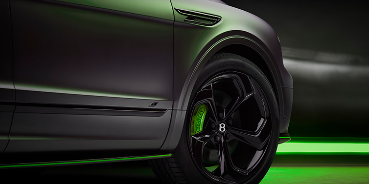 Bentley Leeds Bentley Bentayga S Black Edition SUV exterior wheel detail with Cyber Green brakes with Anthracite Satin paint