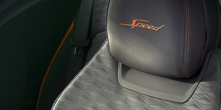 Bentley Leeds Bentley Continental GT Speed coupe seat detail in Gravity Grey hide and Speed emblem in Mandarin by Mulliner coloured embroidery