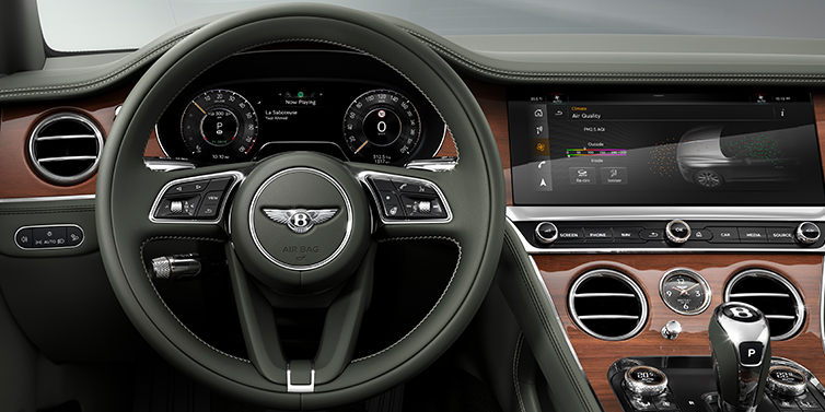 Bentley Leeds New Bentley Continental GT coupe steering wheel and front cabin view in Cumbrian Green hide and Crown Cut walnut veneer